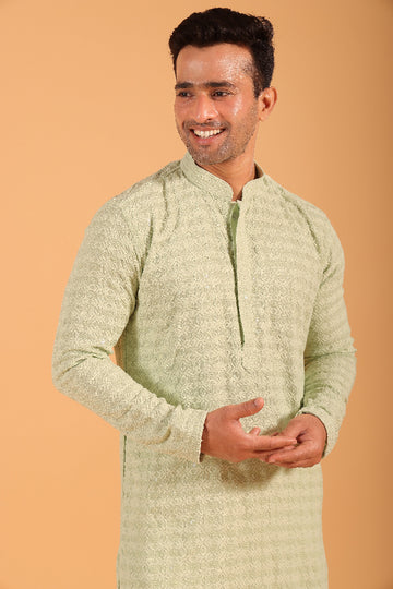 This Pista Green chikankari kurta from Ekyaa combines delicate craftsmanship with modern sophistication. Made from premium viscose rayon, the kurta offers a soft, skin-friendly feel with an elegant fall that flatters your silhouette. The intricate chikankari embroidery, enhanced with transparent sequin detailing, adds a refined touch, while the concealed buttons and tone-on-tone embroidery on the placket and sleeves give it a clean, seamless look.