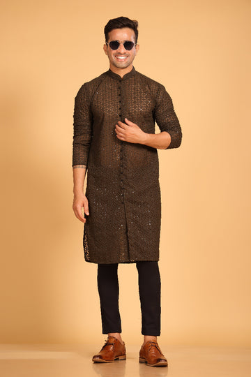 This Mehendi Green georgette front-open kurta embodies a perfect blend of tradition and modern style. The soft georgette fabric drapes elegantly, offering a smooth feel on the skin and a graceful fall that enhances your look. Delicate tone-on-tone embroidery is intricately crafted on the fabric, adding a refined touch to the design. The subtle see-through effect elevates the designer appeal, making it a standout piece for special occasions.