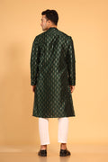 This Mehendi Green silk-blend kurta is designed for comfort and elegance, featuring tone-on-tone threadwork with sequin detailing that runs horizontally for a striking yet subtle effect. Ideal for pujas, haldi, and festive occasions, the kurta is adorned with meenakari buttons along the front placket and finished with a mandarin collar. The knee-length hem adds to its traditional charm, making it a versatile choice for special celebrations.