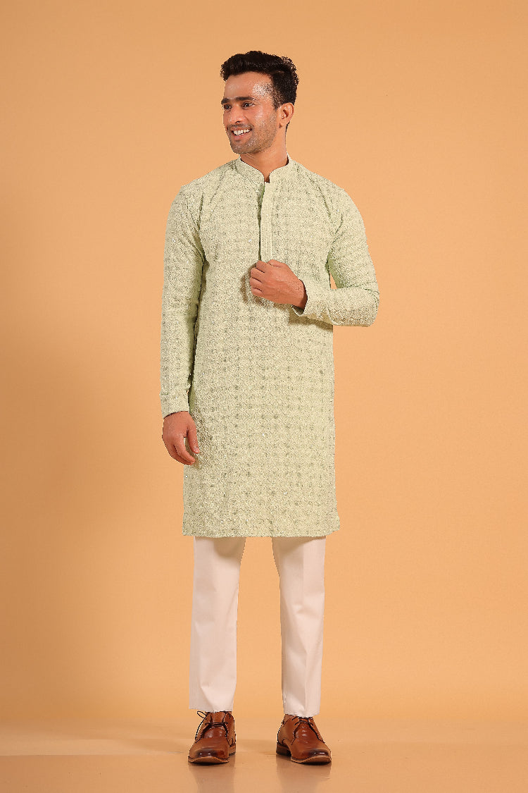 This Pista Green chikankari kurta from Ekyaa combines delicate craftsmanship with modern sophistication. Made from premium viscose rayon, the kurta offers a soft, skin-friendly feel with an elegant fall that flatters your silhouette. The intricate chikankari embroidery, enhanced with transparent sequin detailing, adds a refined touch, while the concealed buttons and tone-on-tone embroidery on the placket and sleeves give it a clean, seamless look.