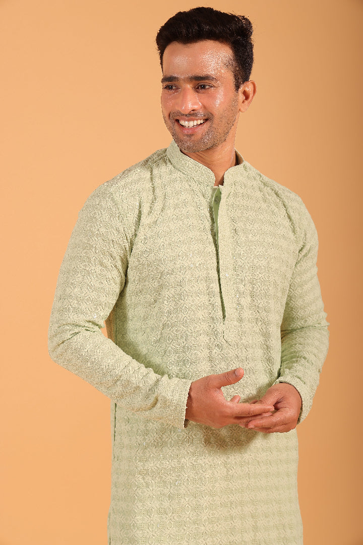 This Pista Green chikankari kurta from Ekyaa combines delicate craftsmanship with modern sophistication. Made from premium viscose rayon, the kurta offers a soft, skin-friendly feel with an elegant fall that flatters your silhouette. The intricate chikankari embroidery, enhanced with transparent sequin detailing, adds a refined touch, while the concealed buttons and tone-on-tone embroidery on the placket and sleeves give it a clean, seamless look.