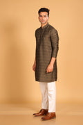 This Mehendi Green kurta combines subtle elegance with intricate detailing. Made from a soft, smooth viscose blend, this charcoal gray kurta offers a soft and smooth feel that is gentle on the skin. The intricate all-over threadwork adds texture and detail to the classic design, making it an excellent choice for both formal and festive occasions. The kurta features a mandarin collar and a front placket with meenakari metal buttons, bringing a refined touch to its sleek silhouette.