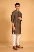 This Mehendi Green kurta combines subtle elegance with intricate detailing. Made from a soft, smooth viscose blend, this charcoal gray kurta offers a soft and smooth feel that is gentle on the skin. The intricate all-over threadwork adds texture and detail to the classic design, making it an excellent choice for both formal and festive occasions. The kurta features a mandarin collar and a front placket with meenakari metal buttons, bringing a refined touch to its sleek silhouette.