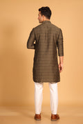 This Mehendi Green kurta combines subtle elegance with intricate detailing. Made from a soft, smooth viscose blend, this charcoal gray kurta offers a soft and smooth feel that is gentle on the skin. The intricate all-over threadwork adds texture and detail to the classic design, making it an excellent choice for both formal and festive occasions. The kurta features a mandarin collar and a front placket with meenakari metal buttons, bringing a refined touch to its sleek silhouette.