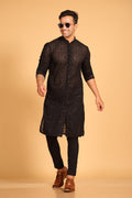 This Black georgette front-open kurta embodies a perfect blend of tradition and modern style. The soft georgette fabric drapes elegantly, offering a smooth feel on the skin and a graceful fall that enhances your look. Delicate tone-on-tone embroidery is intricately crafted on the fabric, adding a refined touch to the design. The subtle see-through effect elevates the designer appeal, making it a standout piece for special occasions.