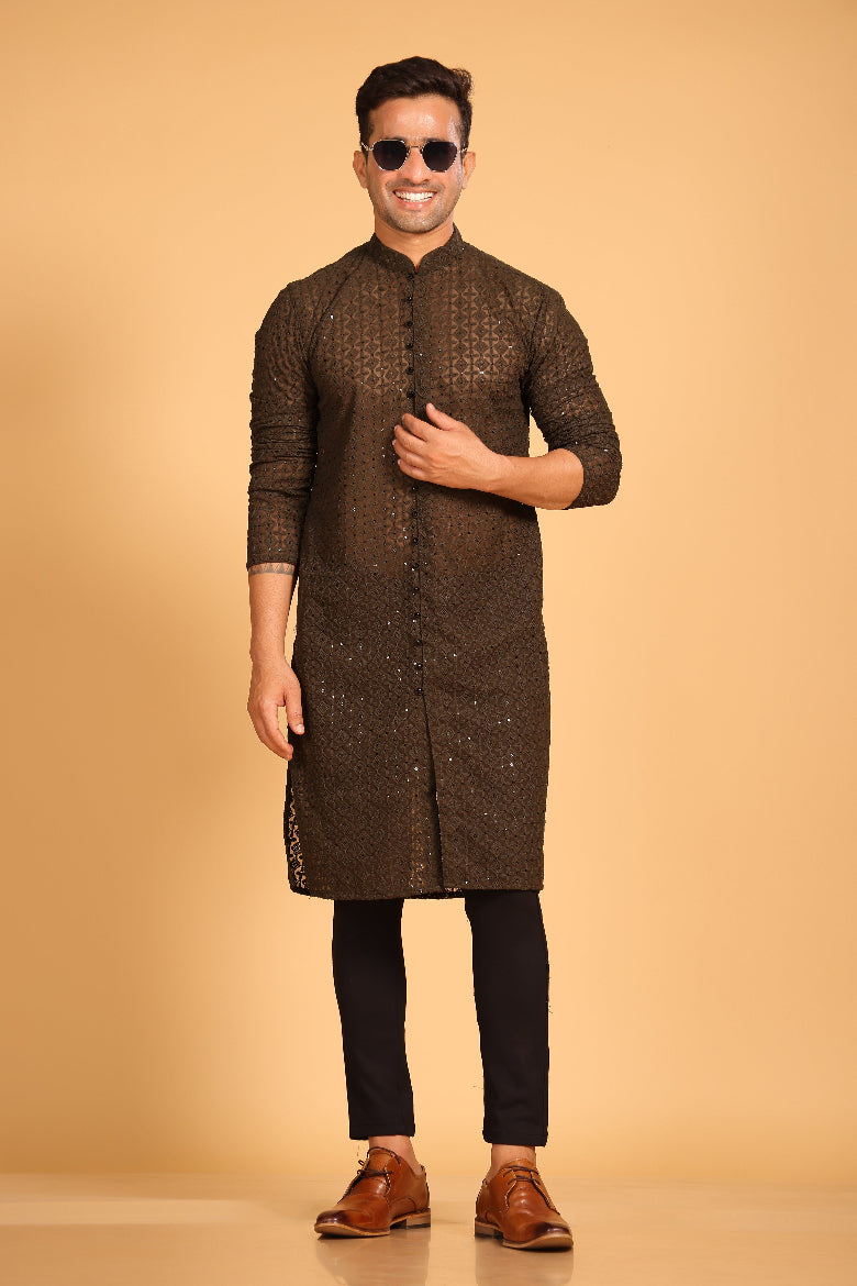 This Mehendi Green georgette front-open kurta embodies a perfect blend of tradition and modern style. The soft georgette fabric drapes elegantly, offering a smooth feel on the skin and a graceful fall that enhances your look. Delicate tone-on-tone embroidery is intricately crafted on the fabric, adding a refined touch to the design. The subtle see-through effect elevates the designer appeal, making it a standout piece for special occasions.