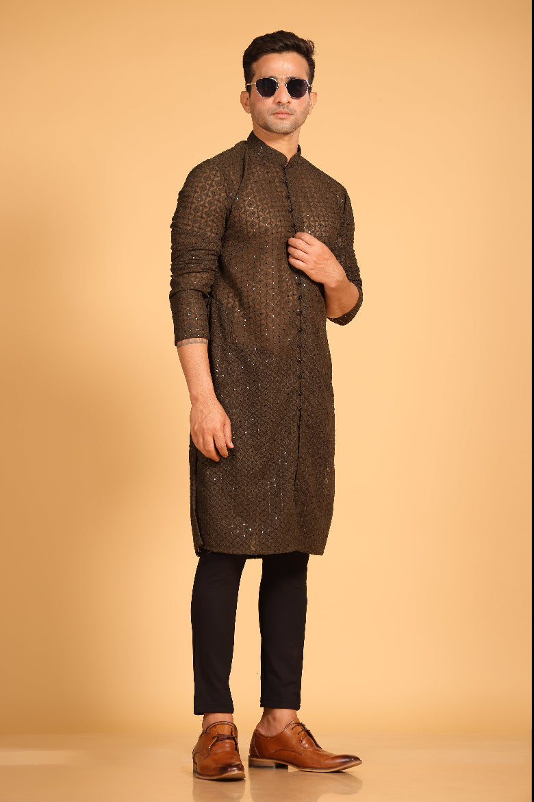 This Mehendi Green georgette front-open kurta embodies a perfect blend of tradition and modern style. The soft georgette fabric drapes elegantly, offering a smooth feel on the skin and a graceful fall that enhances your look. Delicate tone-on-tone embroidery is intricately crafted on the fabric, adding a refined touch to the design. The subtle see-through effect elevates the designer appeal, making it a standout piece for special occasions.
