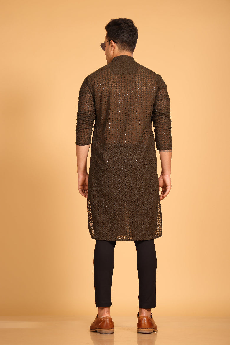 This Mehendi Green georgette front-open kurta embodies a perfect blend of tradition and modern style. The soft georgette fabric drapes elegantly, offering a smooth feel on the skin and a graceful fall that enhances your look. Delicate tone-on-tone embroidery is intricately crafted on the fabric, adding a refined touch to the design. The subtle see-through effect elevates the designer appeal, making it a standout piece for special occasions.