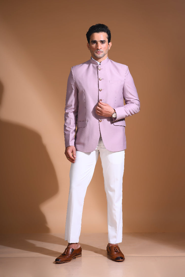  Introducing our Onion Pink Bandhgala Jacket, designed for the modern man who values style and comfort. Crafted from imported terry rayon fabric, this jacket boasts a soft, smooth feel with a plain weave that adds a touch of understated elegance. The slim fit ensures a sleek silhouette, making it perfect for special occasions or formal gatherings. The inside is lined with premium jacquard fabric, providing a luxurious feel and added durability. 