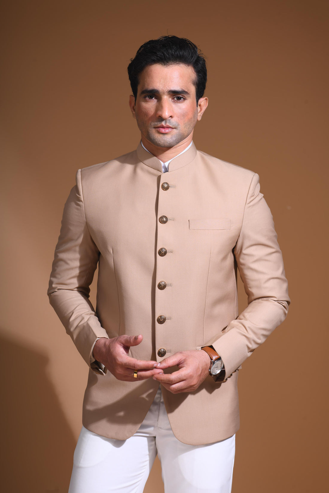 Introducing  our Beige Bandhgala Jacket, designed for the modern man who values style and comfort. Crafted from imported terry rayon fabric, this jacket boasts a soft, smooth feel with a plain weave that adds a touch of understated elegance. The slim fit ensures a sleek silhouette, making it perfect for special occasions or formal gatherings. The inside is lined with premium jacquard fabric, providing a luxurious feel and added durability. 
