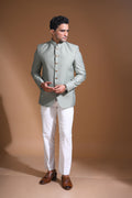 Introducing  our Mint Green Bandhgala Jacket, designed for the modern man who values style and comfort. Crafted from imported terry rayon fabric, this jacket boasts a soft, smooth feel with a plain weave that adds a touch of understated elegance. The slim fit ensures a sleek silhouette, making it perfect for special occasions or formal gatherings. The inside is lined with premium jacquard fabric, providing a luxurious feel and added durability. 