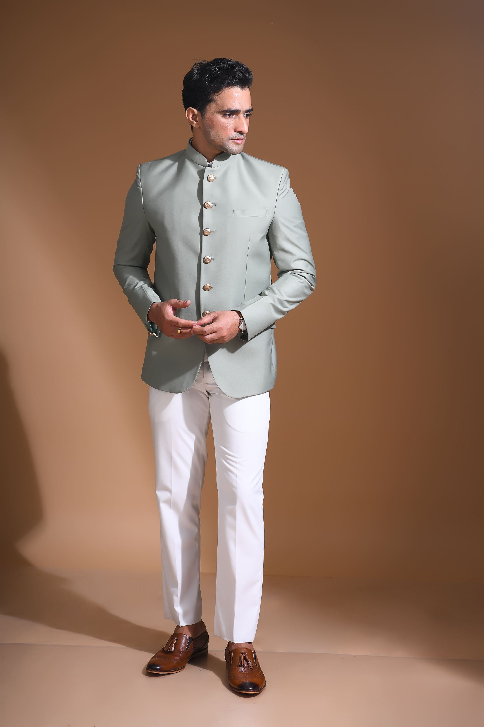 Introducing  our Mint Green Bandhgala Jacket, designed for the modern man who values style and comfort. Crafted from imported terry rayon fabric, this jacket boasts a soft, smooth feel with a plain weave that adds a touch of understated elegance. The slim fit ensures a sleek silhouette, making it perfect for special occasions or formal gatherings. The inside is lined with premium jacquard fabric, providing a luxurious feel and added durability. 