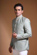 Introducing  our Mint Green Bandhgala Jacket, designed for the modern man who values style and comfort. Crafted from imported terry rayon fabric, this jacket boasts a soft, smooth feel with a plain weave that adds a touch of understated elegance. The slim fit ensures a sleek silhouette, making it perfect for special occasions or formal gatherings. The inside is lined with premium jacquard fabric, providing a luxurious feel and added durability. 