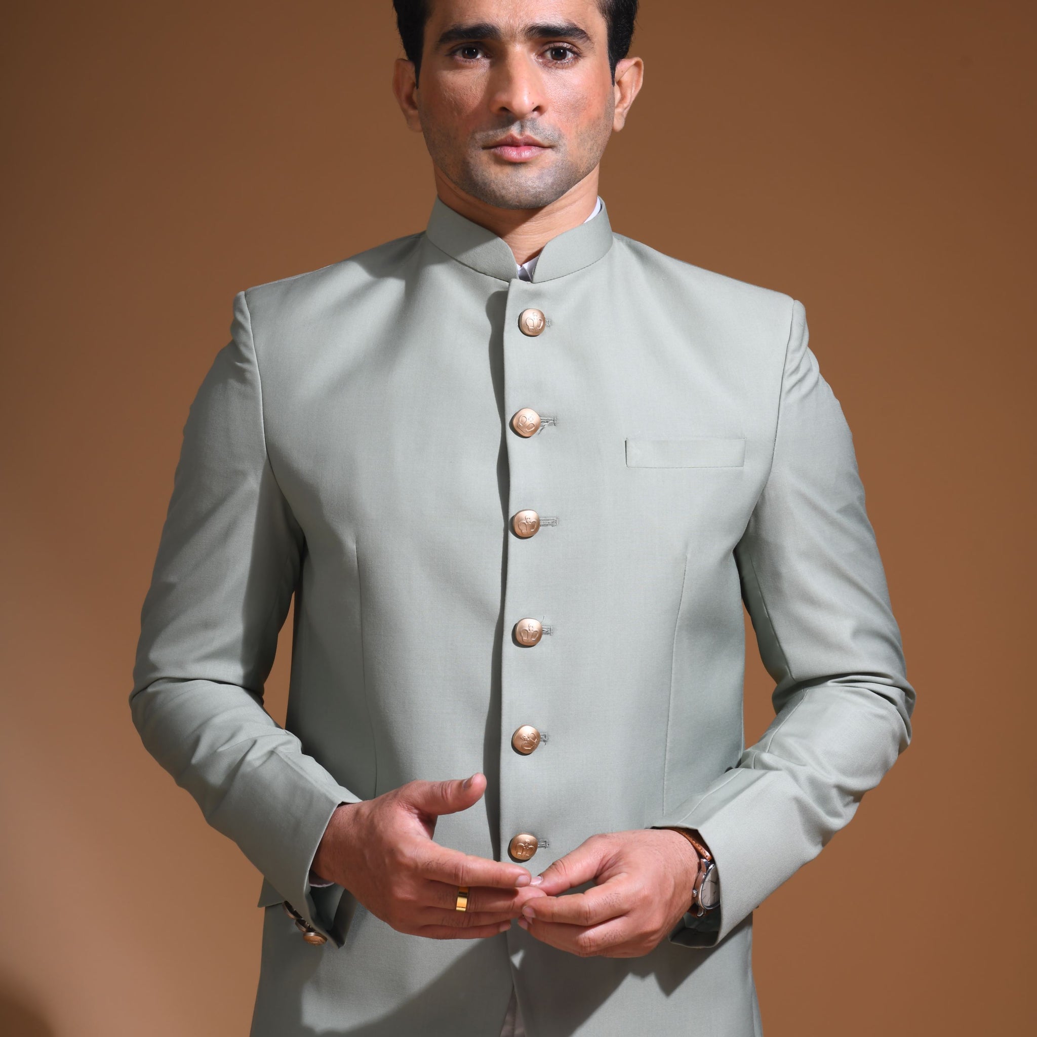 Introducing  our Mint Green Bandhgala Jacket, designed for the modern man who values style and comfort. Crafted from imported terry rayon fabric, this jacket boasts a soft, smooth feel with a plain weave that adds a touch of understated elegance. The slim fit ensures a sleek silhouette, making it perfect for special occasions or formal gatherings. The inside is lined with premium jacquard fabric, providing a luxurious feel and added durability. 