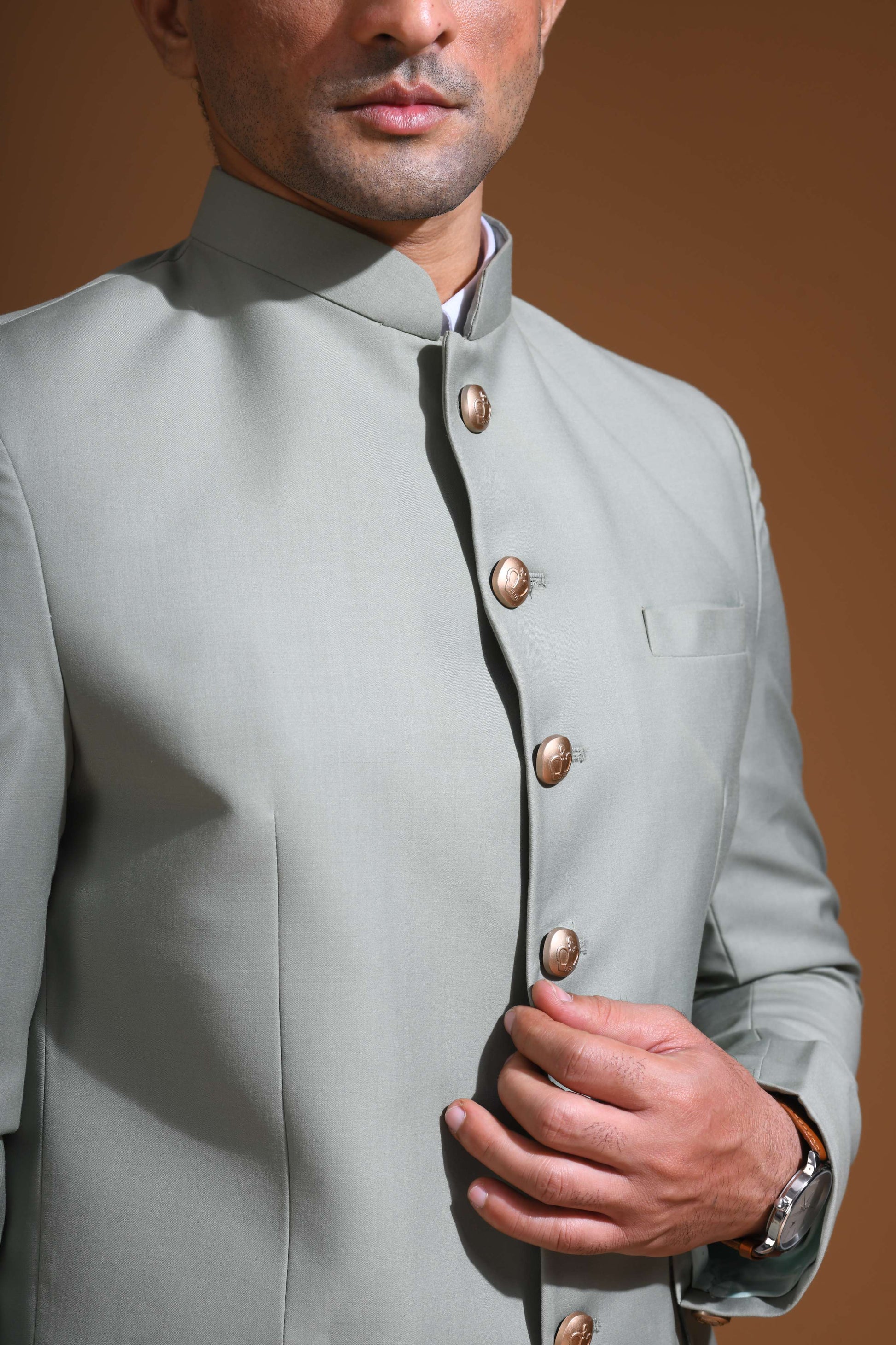 Introducing  our Mint Green Bandhgala Jacket, designed for the modern man who values style and comfort. Crafted from imported terry rayon fabric, this jacket boasts a soft, smooth feel with a plain weave that adds a touch of understated elegance. The slim fit ensures a sleek silhouette, making it perfect for special occasions or formal gatherings. The inside is lined with premium jacquard fabric, providing a luxurious feel and added durability. 