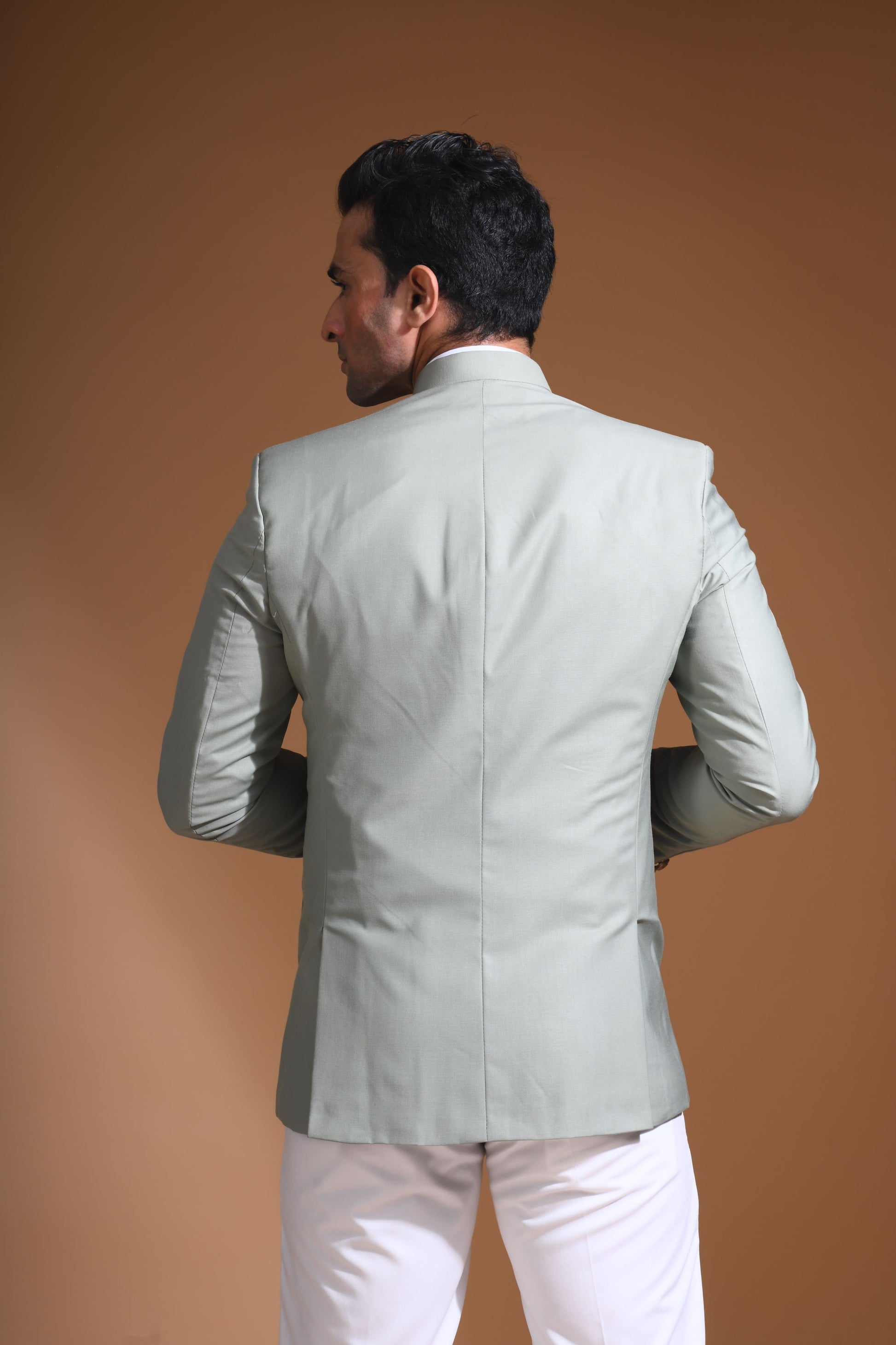 Introducing our Mint Green Bandhgala Jacket, designed for the modern man who values style and comfort. Crafted from imported terry rayon fabric, this jacket boasts a soft, smooth feel with a plain weave that adds a touch of understated elegance. The slim fit ensures a sleek silhouette, making it perfect for special occasions or formal gatherings. The inside is lined with premium jacquard fabric, providing a luxurious feel and added durability. 