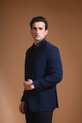 Introducing our stunning Navy Blue Tuxedo Jacket, designed to exude sophistication and class. Made from imported stretchable crepe fabric, this tuxedo jacket offers both a luxurious look and the utmost comfort in movement. The rich Blue color, paired with a standard tuxedo lapel and a sleek single-button front fastening, makes this piece perfect for formal events. The premium jacquard lining inside adds a touch of refinement, while contrasting buttons on the front and sleeves enhance its elegance.