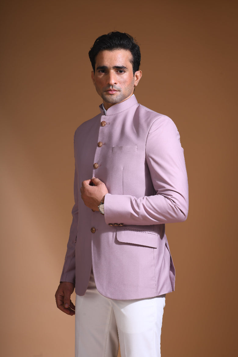  Introducing our Onion Pink Bandhgala Jacket, designed for the modern man who values style and comfort. Crafted from imported terry rayon fabric, this jacket boasts a soft, smooth feel with a plain weave that adds a touch of understated elegance. The slim fit ensures a sleek silhouette, making it perfect for special occasions or formal gatherings. The inside is lined with premium jacquard fabric, providing a luxurious feel and added durability. 