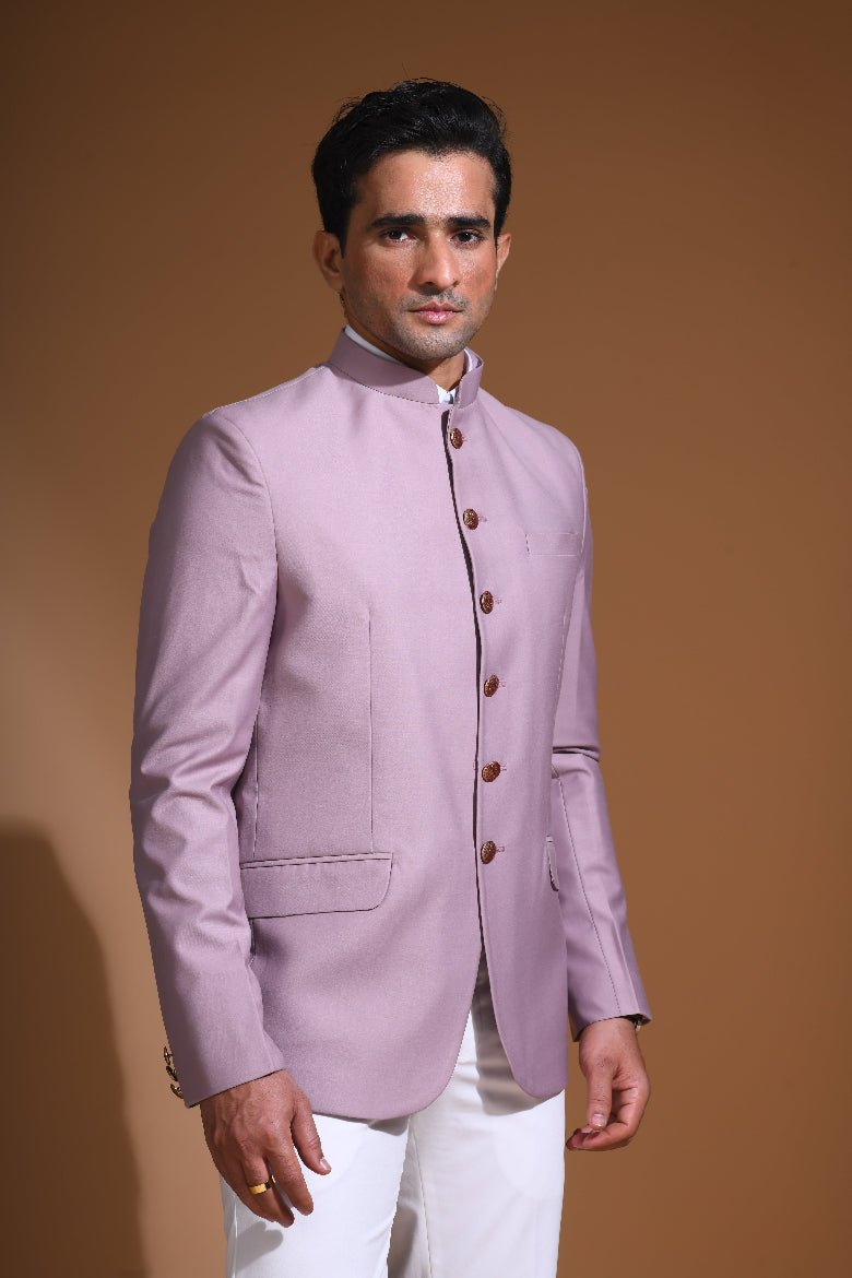  Introducing our Onion Pink Bandhgala Jacket, designed for the modern man who values style and comfort. Crafted from imported terry rayon fabric, this jacket boasts a soft, smooth feel with a plain weave that adds a touch of understated elegance. The slim fit ensures a sleek silhouette, making it perfect for special occasions or formal gatherings. The inside is lined with premium jacquard fabric, providing a luxurious feel and added durability. 