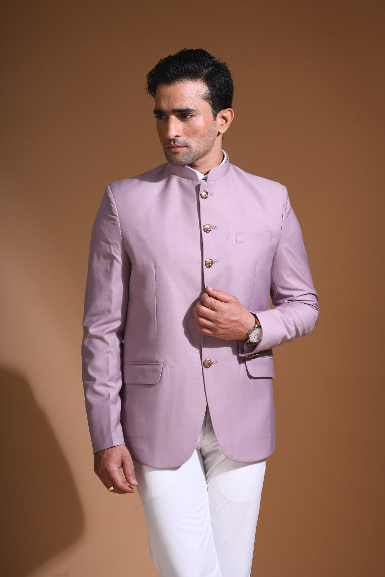  Introducing our Onion Pink Bandhgala Jacket, designed for the modern man who values style and comfort. Crafted from imported terry rayon fabric, this jacket boasts a soft, smooth feel with a plain weave that adds a touch of understated elegance. The slim fit ensures a sleek silhouette, making it perfect for special occasions or formal gatherings. The inside is lined with premium jacquard fabric, providing a luxurious feel and added durability. 